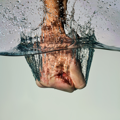 fist punching water